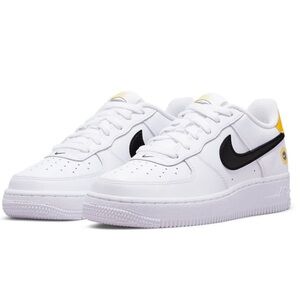 Nike White Leather Low-Top Sneakers with Black Swoosh and Yellow Heel